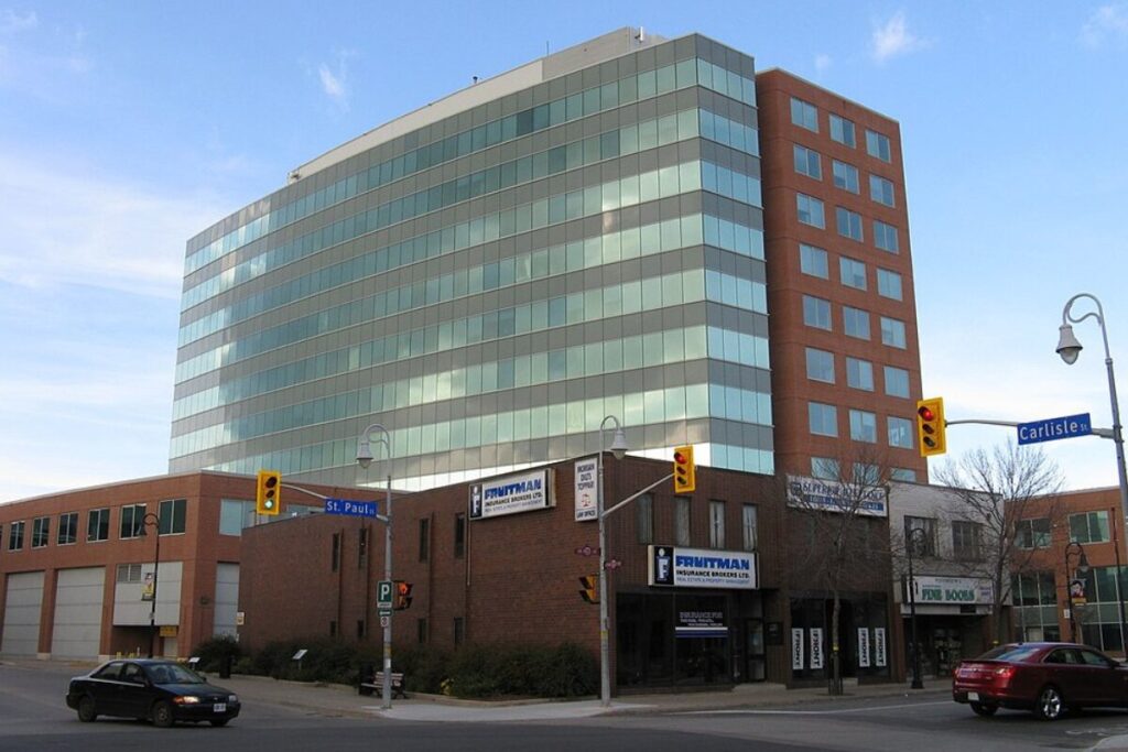 Glass mid-rise office building on a downtown corner in St. Catharines.